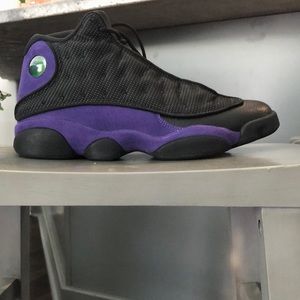 A pair of Black and purple xiii Jordan’s worn once. Size 10 Men smoke free home